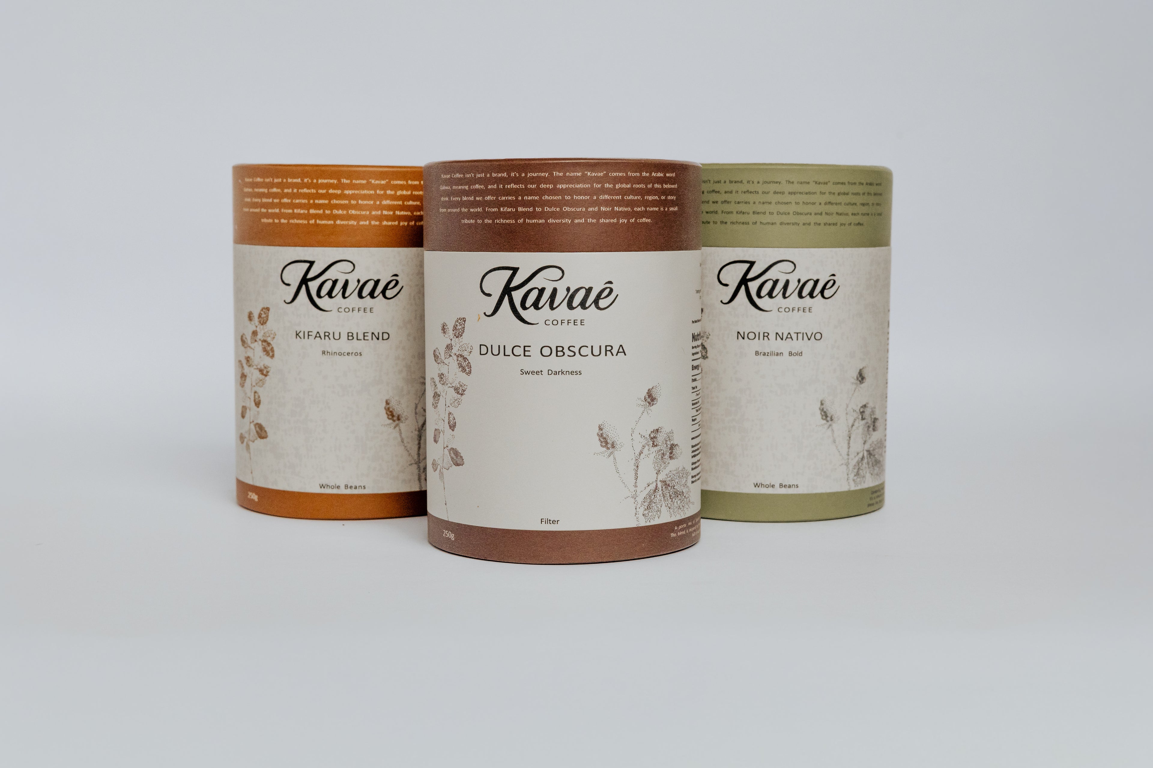 Three Káváe coffee containers on a white background