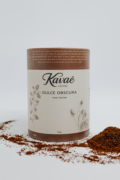 Kaváé coffee container with ground coffee on a light background