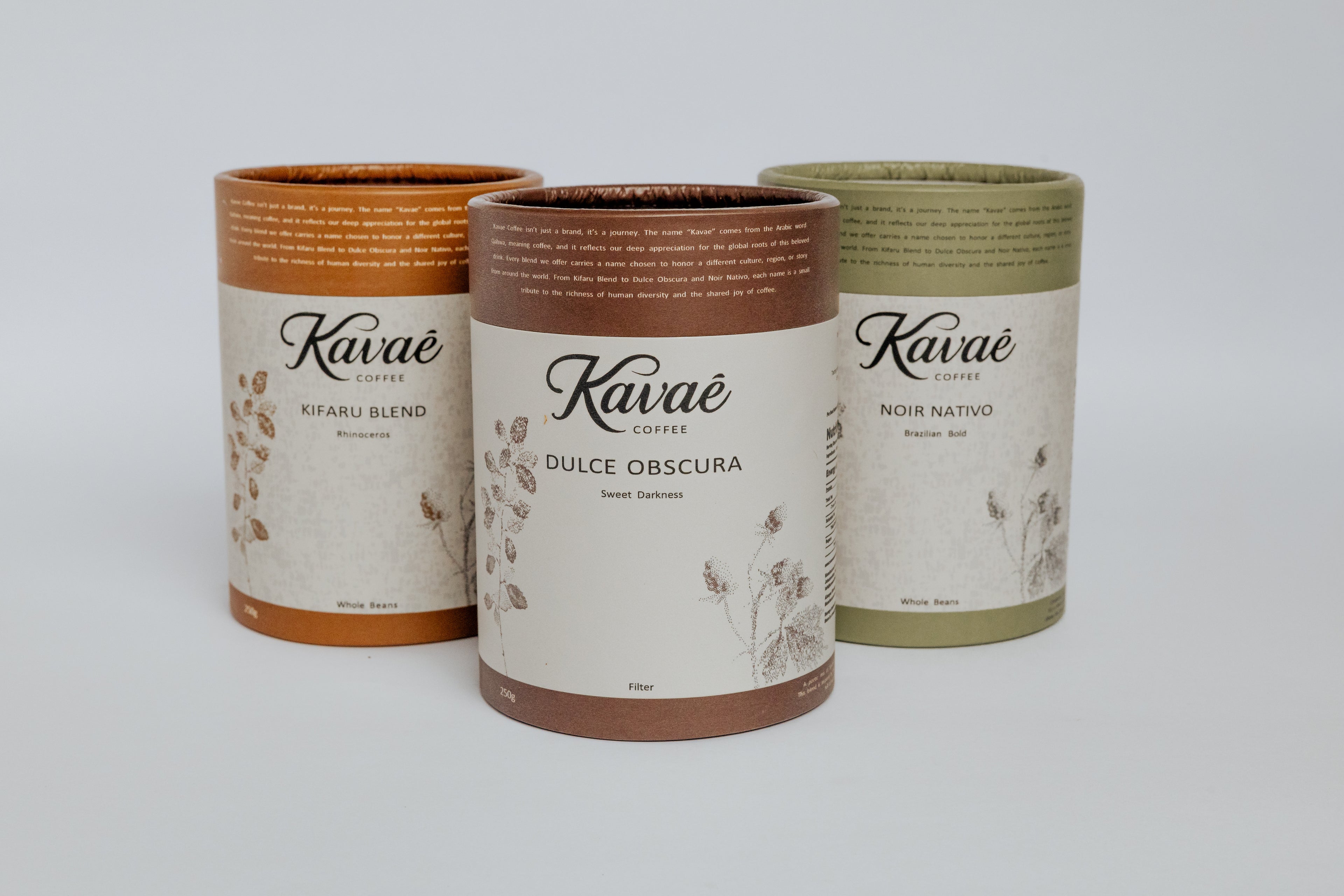 Three Kavae coffee cans with different labels on a white background